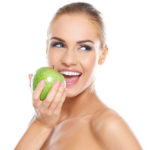 Andrew Baderski Dental -Lady with Apple