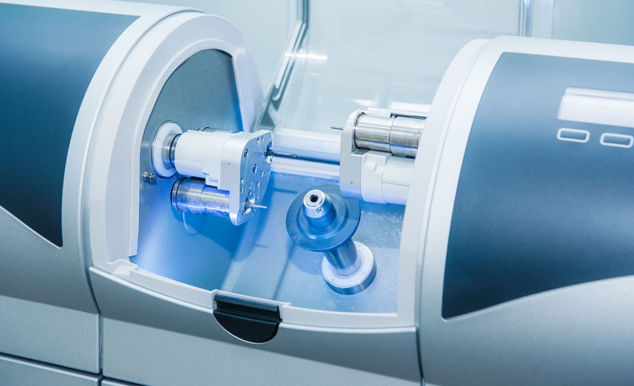 CAD CAM dental computer-aided machine in a highly modern dental laboratory for prosthesis and crowns milling. Dentistry, prostodontics, prosthetics and medical computer technology concept