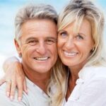 Andrew Baderski Dental - happy couple showing their beautiful smiles