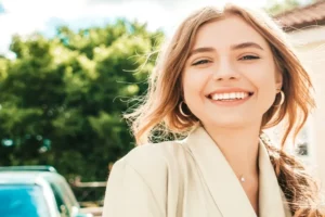 A happy female patient of Andrew Baderski Dental showing her beautiful smile