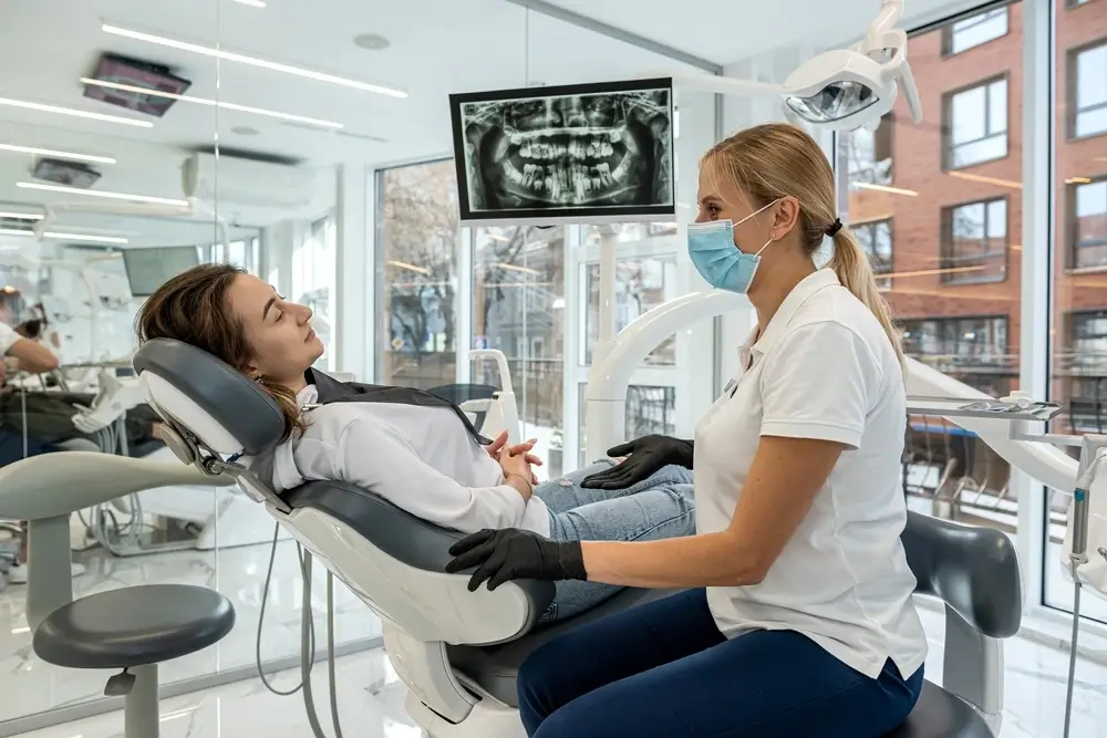 The dentist at Andrew Baderski Dental is explaining the Xray result to the patient